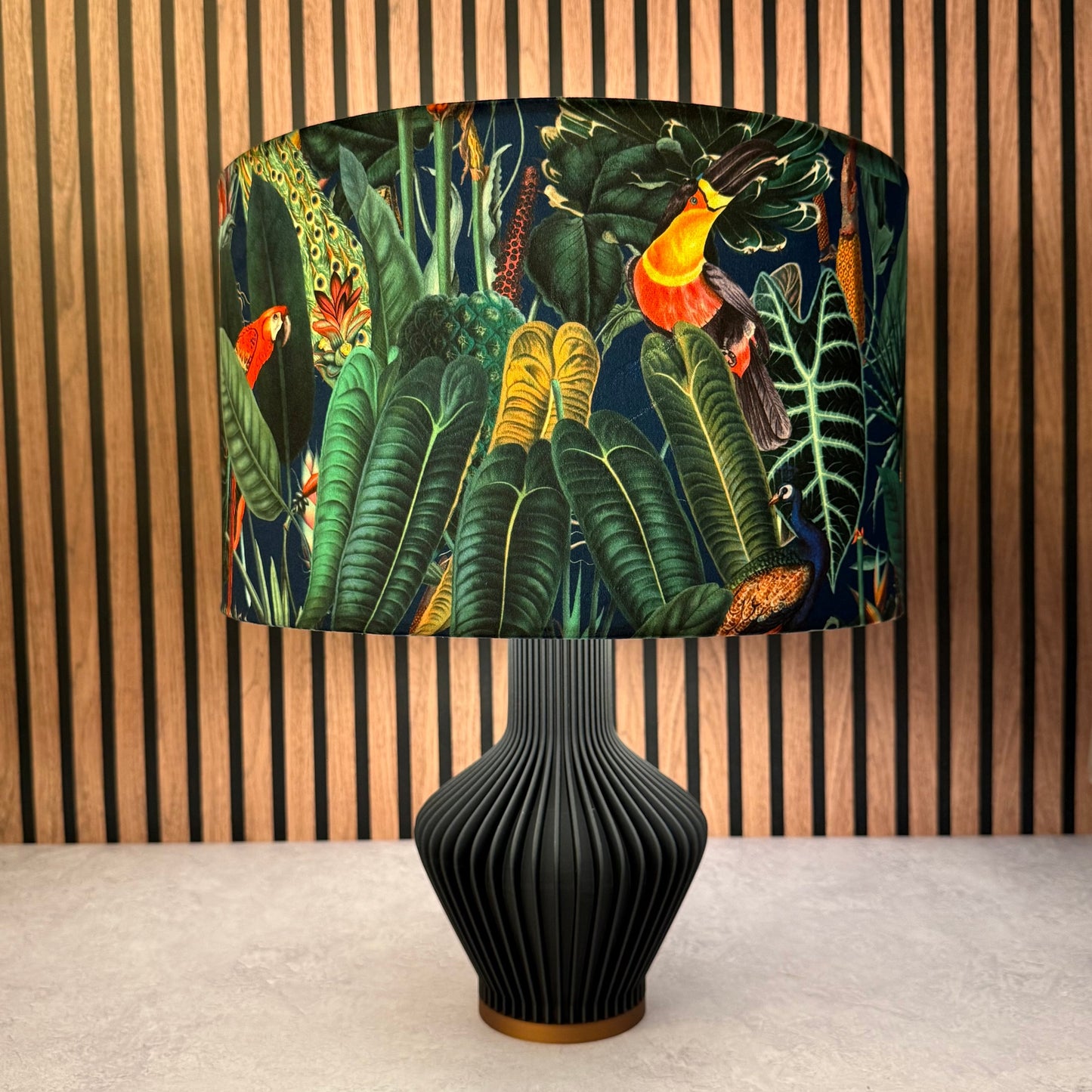 The Rainforest footstool in black velvet
