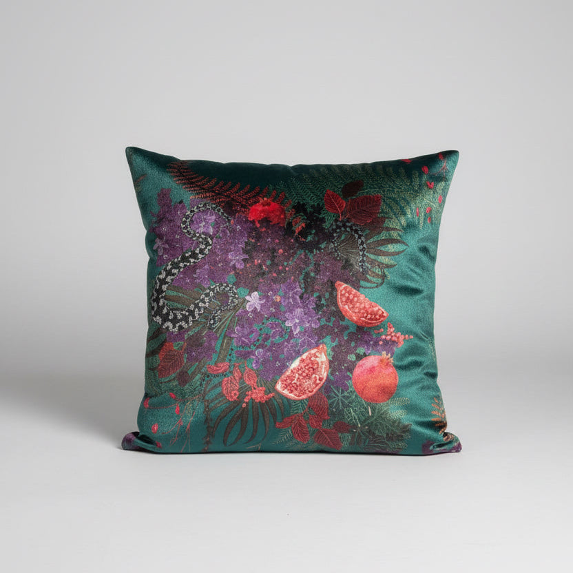 Decorative pillow with a colorful floral pattern on a snake print surface. Becca Who